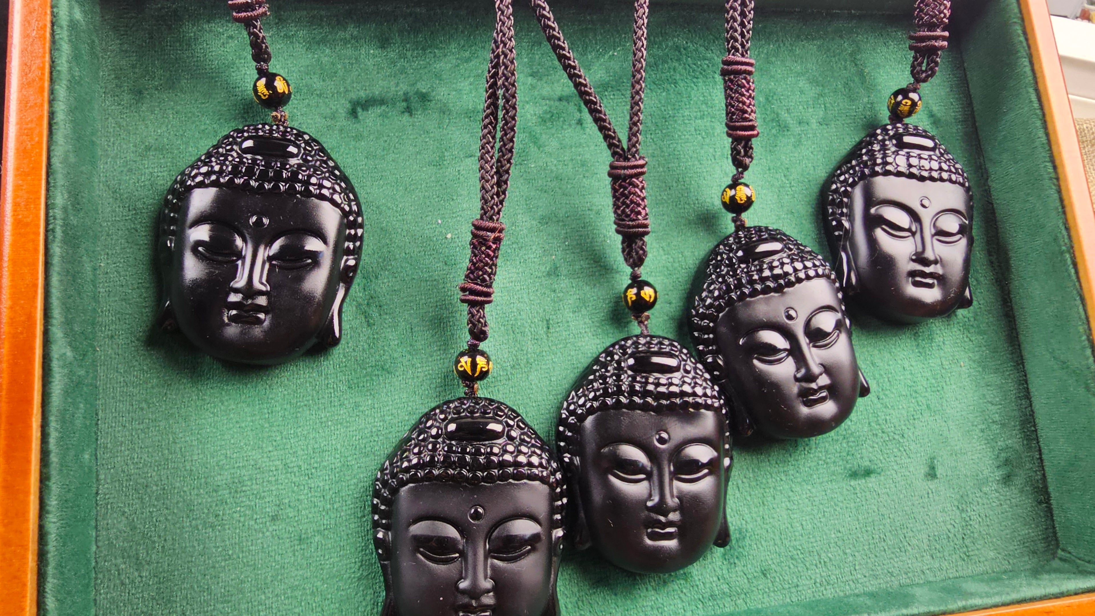 Obsidian Buddha Head Pendant Hand-carved crystal necklace symbolizing peace, mindfulness and protection.