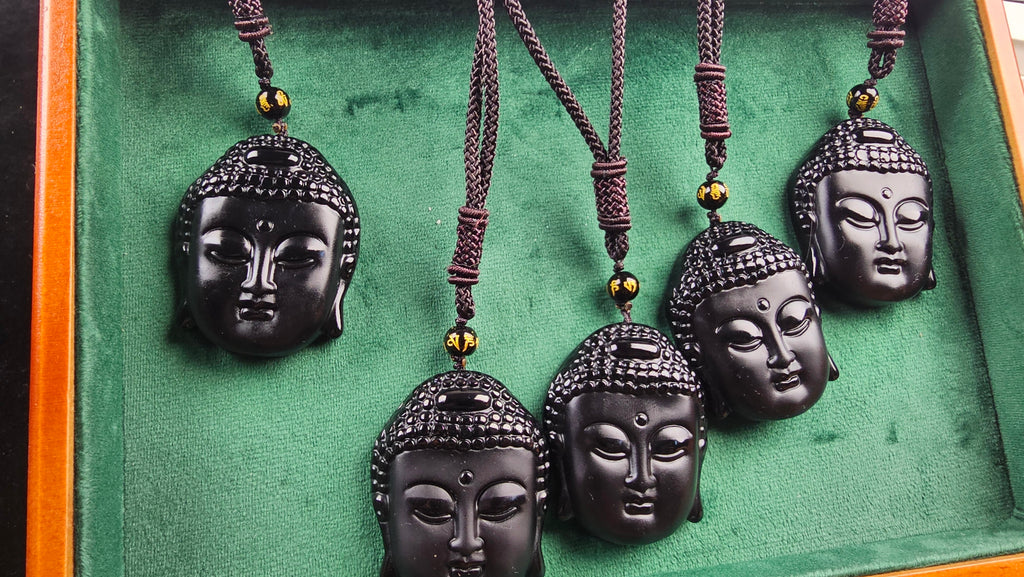 Obsidian Buddha Head Pendant Hand-carved crystal necklace symbolizing peace, mindfulness and protection.