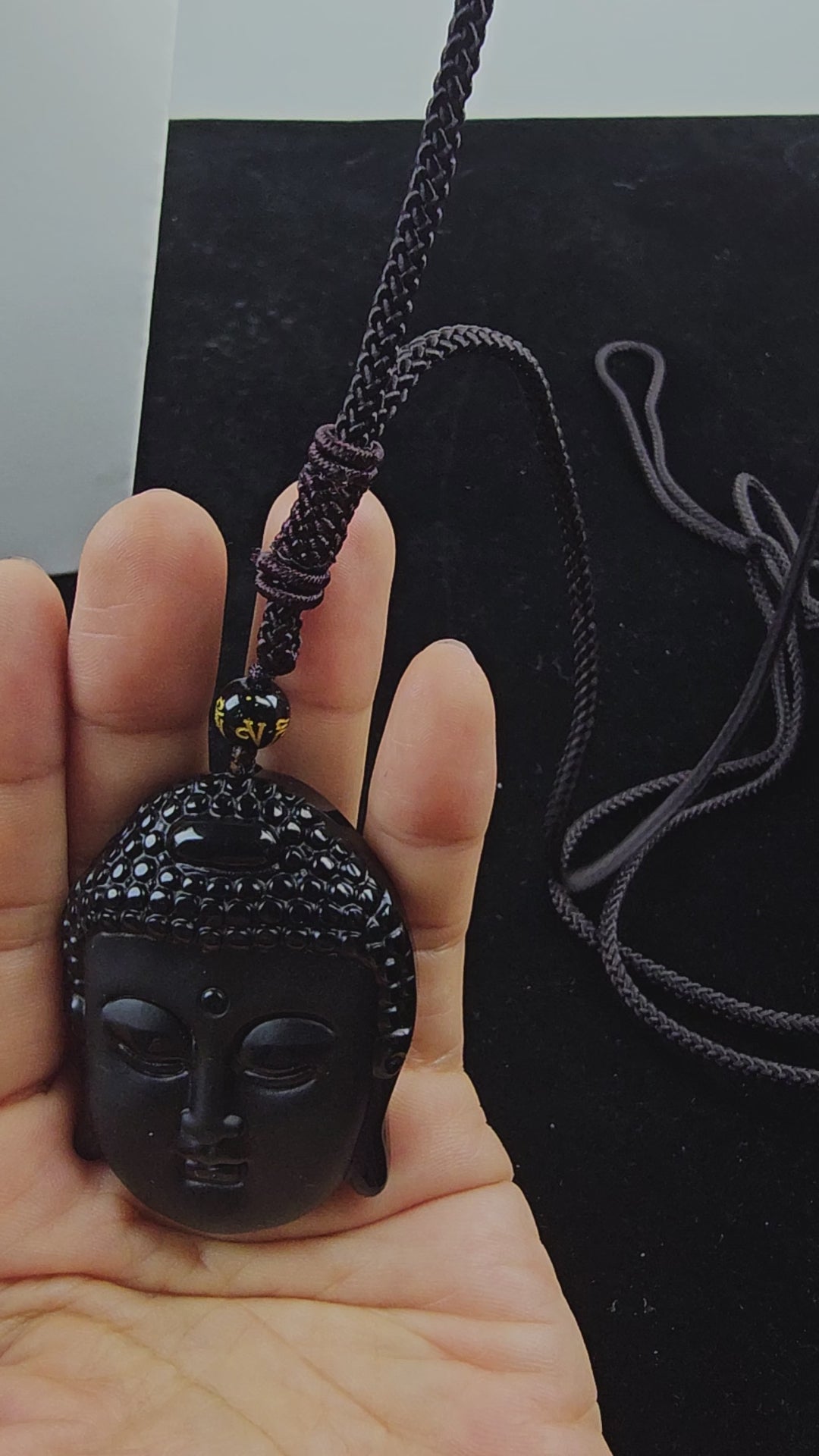 Obsidian Buddha Head Pendant Hand-carved crystal necklace symbolizing peace, mindfulness and protection.